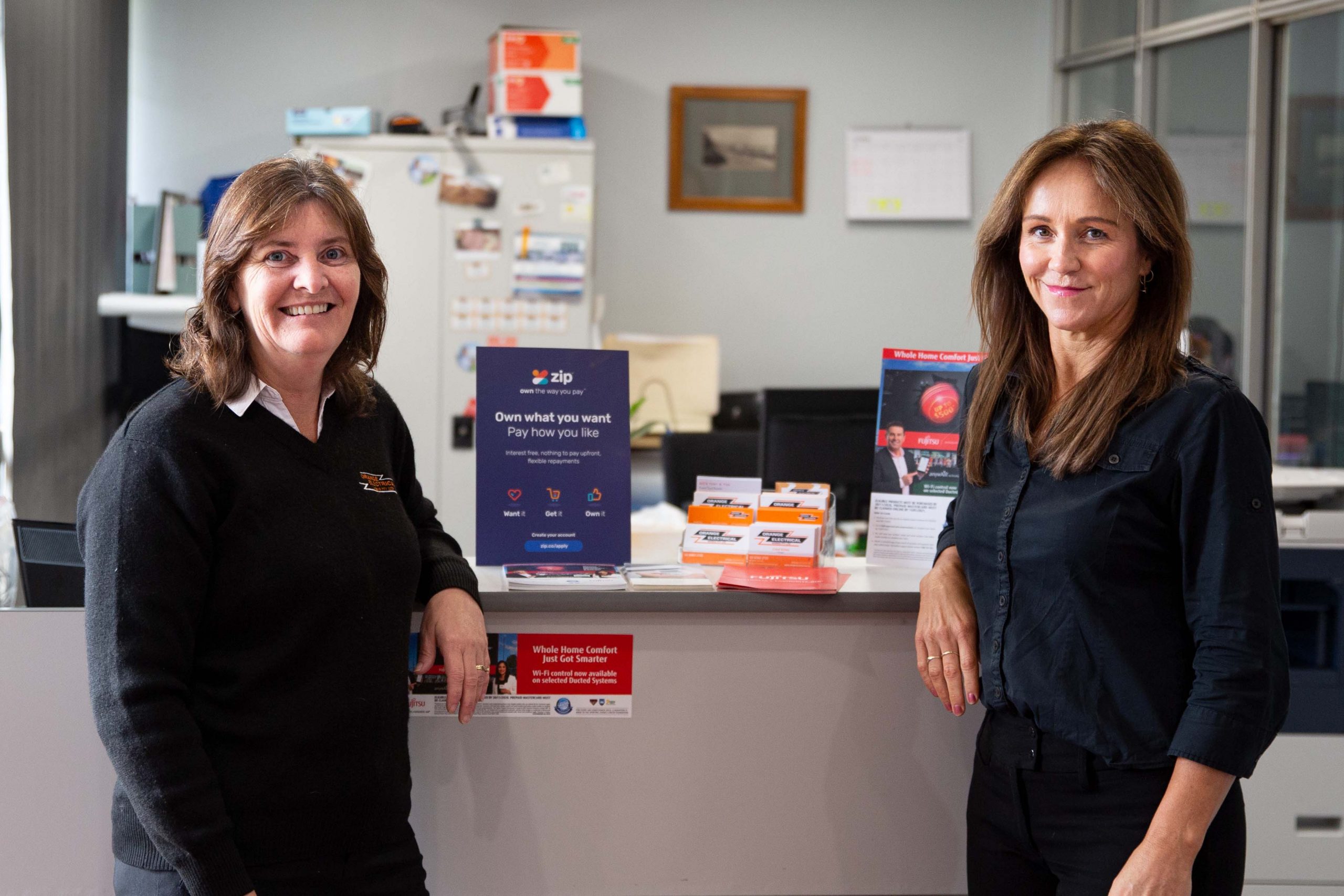 Two administration staff from Orange Electrical Works standing inside our new offices located in Barrett Court, Orange, NSW