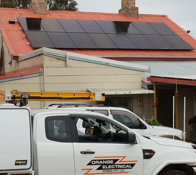 Ford Ranger ute owned by Orange Electrical Works parked in front of house with Solahart solar panels installed