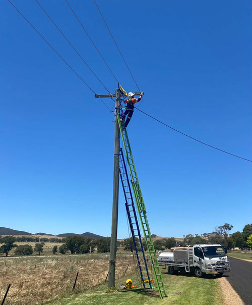 Orange Electrical Works performing Level 2 electrical work on power pole in Orange NSW
